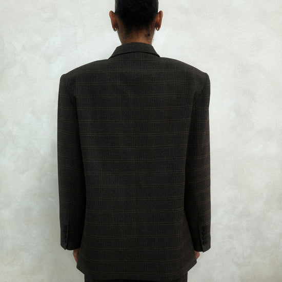 Back view of brown windowpane plaid Archer Blazer showing tailored construction and windowpane check pattern, styled with matching pants