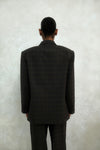 Back view of brown windowpane plaid Archer Blazer showing tailored construction and windowpane check pattern, styled with matching pants